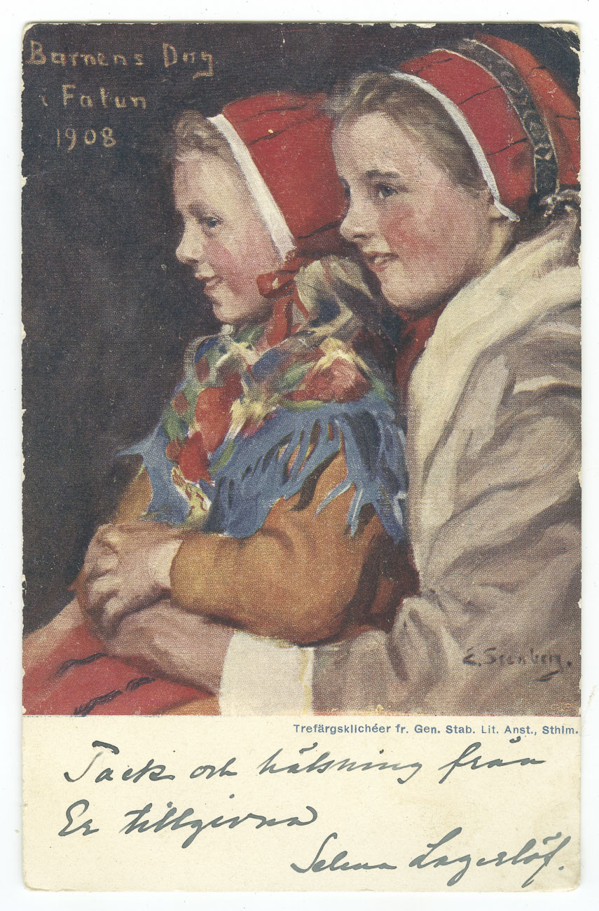 Färglagt vykort. Trefärgsklichée med två flickor i folkdräkt och röda hättor. På vykortet står det "Tack och hälsningar från er tillgivna Selma Lagerlöf".